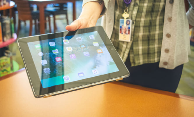 Digital Library - person holding ipad